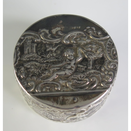 659 - A continental silver box, bears import marks, for London, 1895, of cylindrical form, with lift-off l... 