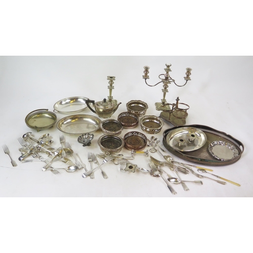 663 - A collection of assorted plated wares including coasters, tea pot, entree dishes, candlesticks etc.