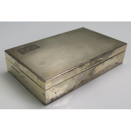 664 - An Elizabeth II silver cigarette box, maker Poston Products Ltd, Birmingham, 1956, initialled, of re... 