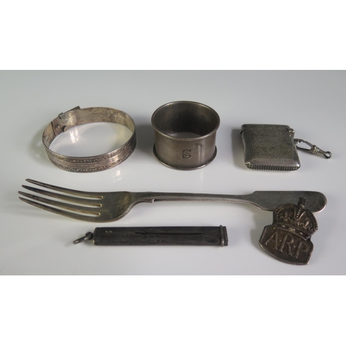 670 - A mixed collection of silver wares, various makers and dates includes fork, napkin ring, bangle etc ... 