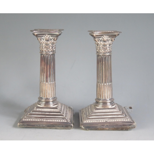 673 - A pair of Edward VII silver Corinthian column candlesticks, maker Frank Cobb & Co, Sheffield, 1906, ... 