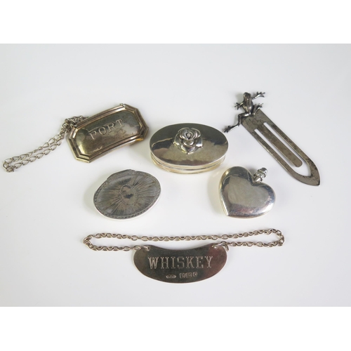 675 - A mixed collection of silver wares, various makers and dates, includes wine and spirit labels, patch... 