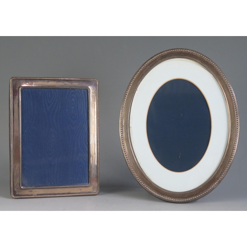 680 - Two silver photograph frames, various makers and dates, 16 x 12cm and 20 x 16cm. (2)