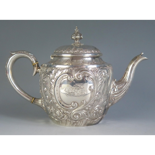 681 - A Victorian silver teapot, maker Martin, Hall & Co, London, 1890, monogrammed, of ovoid form with wr... 