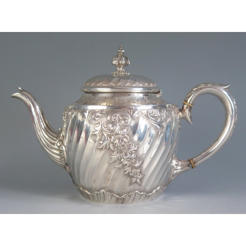 681 - A Victorian silver teapot, maker Martin, Hall & Co, London, 1890, monogrammed, of ovoid form with wr... 