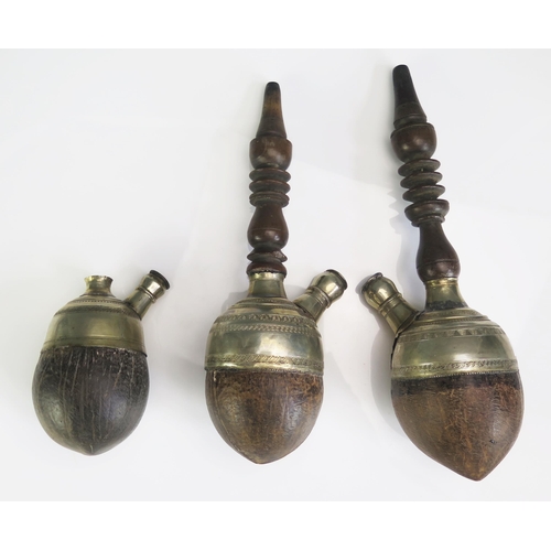 685 - Three coconut and silver mounted hookah pipe bowls and stems, (3).