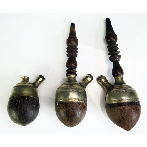 685 - Three coconut and silver mounted hookah pipe bowls and stems, (3).