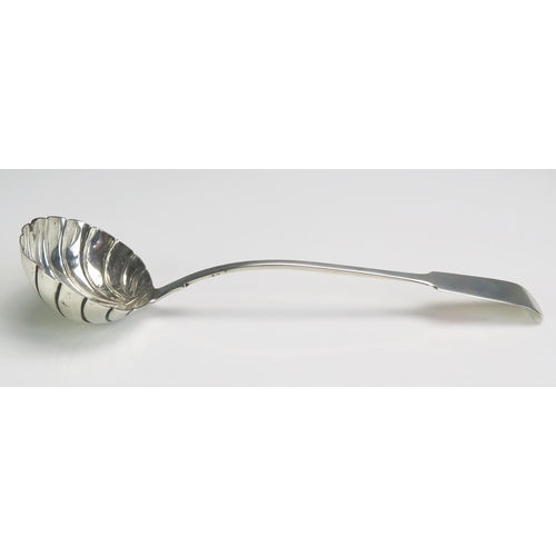 687 - A Victorian silver Fiddle pattern soup ladle, maker's mark rubbed and worn, London, 1842, with shell... 