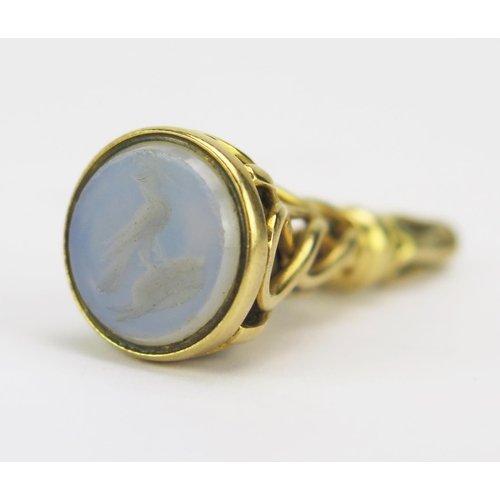 70 - A 19th Century High Carat Precious Yellow Metal Watch Key with chalcedony matrix engraved with a cor... 