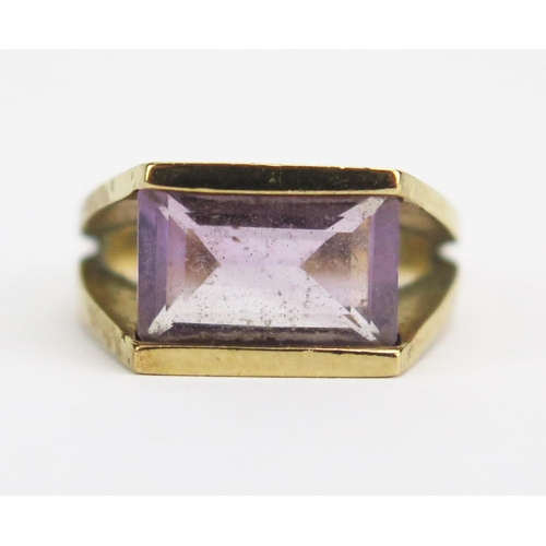 8 - A Modernist 9ct Gold and Amethyst Dress Ring with split shank, c. 11.2x6.3mm stone, size K, hallmark... 