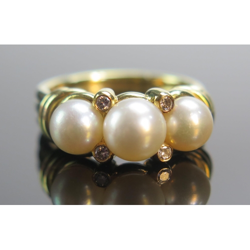 81 - An 18ct Gold, Pearl or Cultured Pearl and Diamond Ring, size O.5, London 1989, DAS, 9.5g