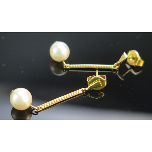 82 - A Pair of 9ct Gold and Cultured Pearl Pendant Earrings, 36.2mm drop, hallmarked, 2.85g