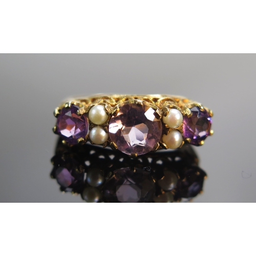 85 - A 9ct Gold, Amethyst and Cultured Pearl Ring, size L.25, hallmarked, 3.05g