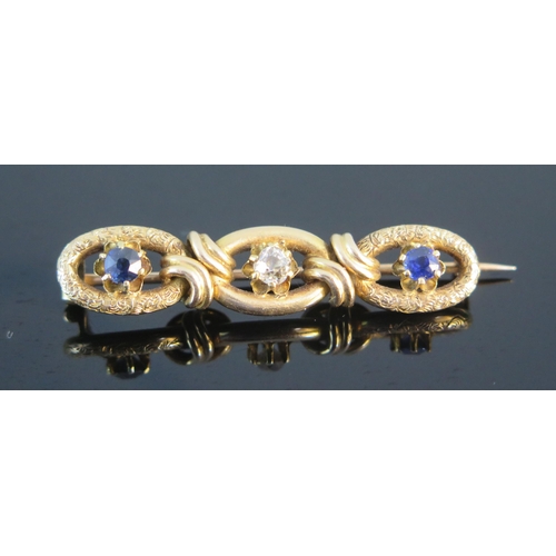 89 - A Victorian Sapphire and Diamond Three Stone Brooch in a high carat precious yellow metal setting wi... 