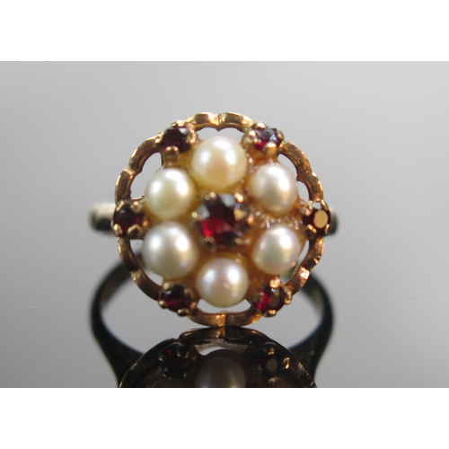 92 - A 9ct Rose Gold, Garnet and Cultured Pearl Cluster Ring, 14.6mm head, size K, stamped 9CT, 3.95g