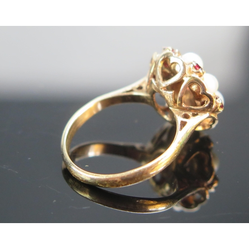 92 - A 9ct Rose Gold, Garnet and Cultured Pearl Cluster Ring, 14.6mm head, size K, stamped 9CT, 3.95g