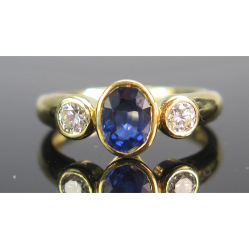 96 - An 18ct Gold, Sapphire and Diamond Three Stone Ring, 7.75x5.8mm principal stone with 3.9mm brilliant... 