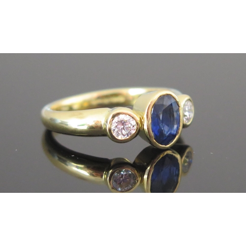 96 - An 18ct Gold, Sapphire and Diamond Three Stone Ring, 7.75x5.8mm principal stone with 3.9mm brilliant... 