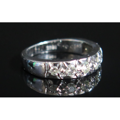 148 - An 18ct White Gold and Graduated Diamond Half Eternity Ring, size K.5, stamped 18CT, 5.76g