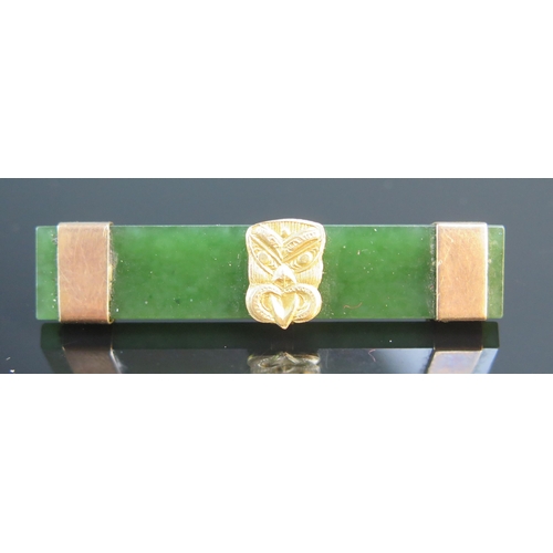 178 - A 9ct Gold Mounted Nephrite Brooch decorated with a Hei-tiki (49.5mm long), one other with yellow me... 