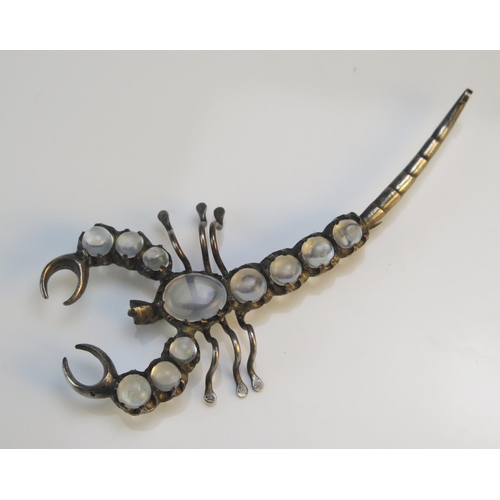 197 - A Moonstone and White Metal Scorpion Brooch, 69.7mm long, 5.74g