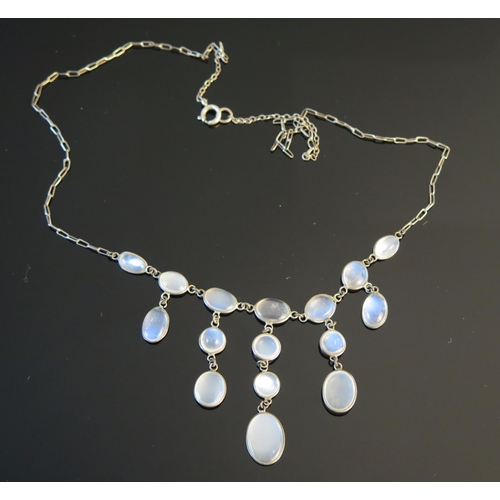 198 - A Moonstone Fringe Necklace in a precious white metal setting, 17.75