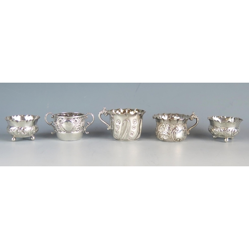 560 - A mixed collection of small cups and jugs, various makers and dates, total weight of silver 148gms, ... 