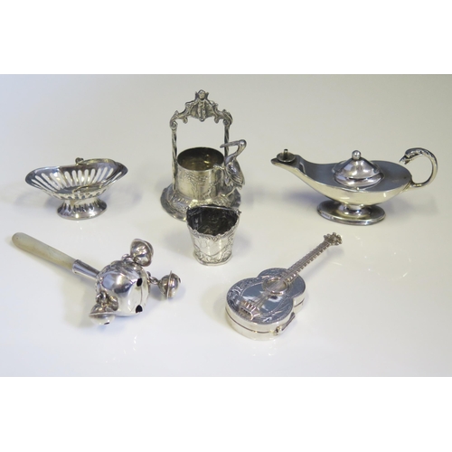 569 - A collection of assorted silver miniature novelties, various makers and dates, includes child's ratt... 