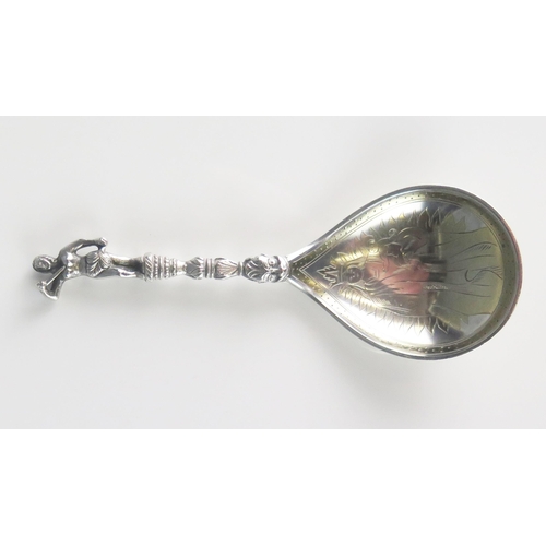 585 - A Swedish silver christening spoon, stamped marks, with gilded banded decoration to the pear-shaped ... 