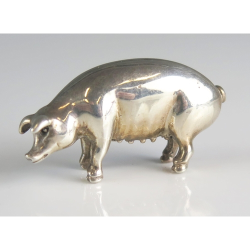 587 - A continental miniature silver model of a sow, stamped marks, 4.5cm long, 15gms, 0.50ozs