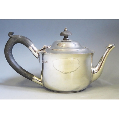 599 - A George V silver teapot, maker C S Harris & Sons Ltd, London, 1913, of circular outline, 21cm long,... 