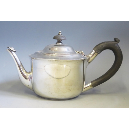 599 - A George V silver teapot, maker C S Harris & Sons Ltd, London, 1913, of circular outline, 21cm long,... 