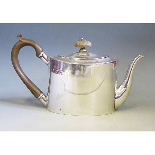 601 - A George V silver bachelors teapot, maker George Nathan & Ridley Hayes, Chester 1911, of oval outlin... 