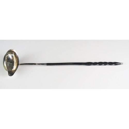 611 - A George III silver toddy ladle all marks worn, London, 1799, mounted on a baleen spiral twist handl... 