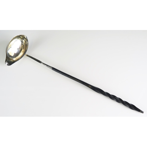 611 - A George III silver toddy ladle all marks worn, London, 1799, mounted on a baleen spiral twist handl... 