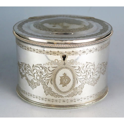 612 - A silver plated oval tea caddy by Elkington & Co, crested and initialled, with chased foliate decora... 