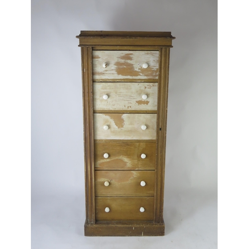 1514 - A Victorian stained pine Wellington chest, with moulded top and six short drawers with hinged stiles... 