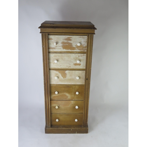 1514 - A Victorian stained pine Wellington chest, with moulded top and six short drawers with hinged stiles... 