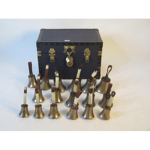 1089A - A set of seventeen bell ringers hand bells, contained in a case.