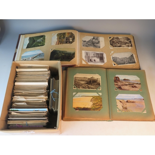 1608A - A collection of assorted postcards contained in an album and loose.