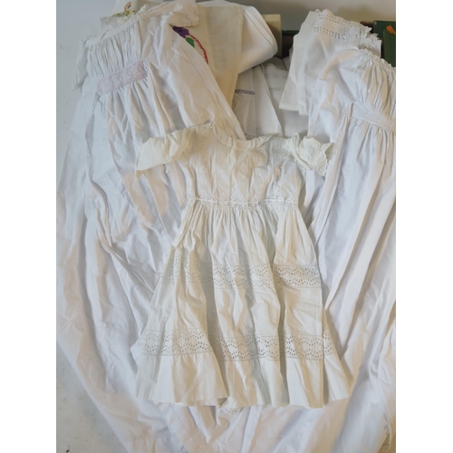 1623 - A child's Christening gown with cut work decoration, petticoats, calf gloves, napkins, table linen, ... 