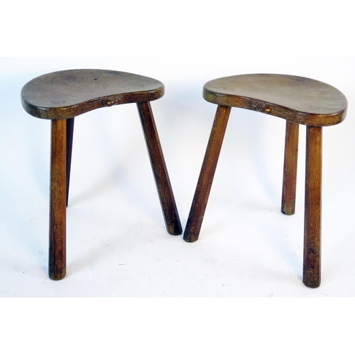 1636 - Robert Mouseman Thompson (Kilburn): a pair of  oak cow stools, the kidney shaped seats on three octa... 