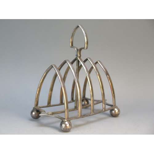 625 - An Edward VII silver four-division toast rack, maker John Henry Potter, Sheffield, 1902, of arched o... 