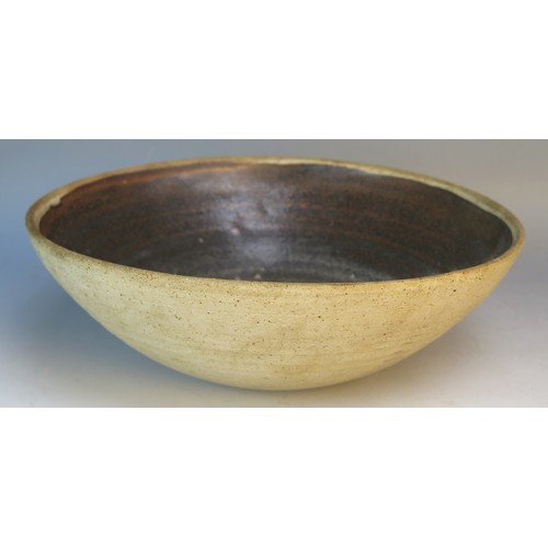 1126A - David Leach, a pottery fruit bowl, with brown oxide variegated decoration, impressed mark to the bas... 