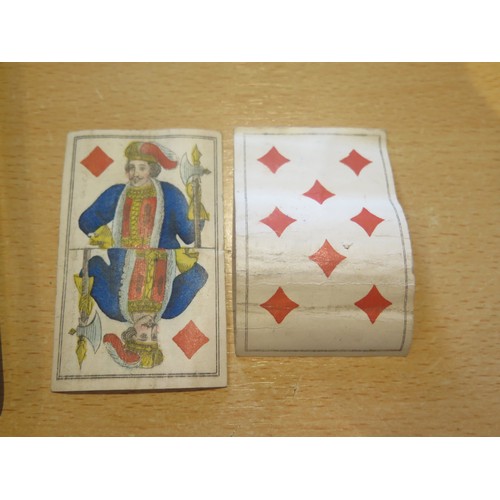 1564 - A 19th century German castle  part set of playing cards, 50/52, together with two other 19th century... 