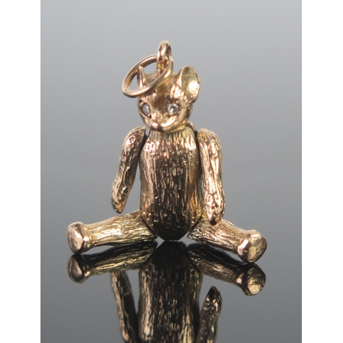 11 - A 9ct Gold and Diamond Articulated Teddy Bear Pendant, 42.6mm drop, hallmarked, 9.85g