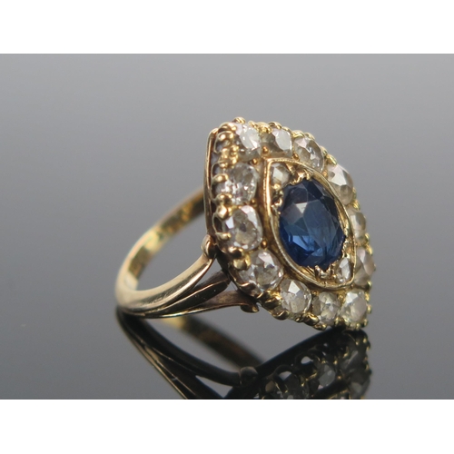 111 - An 18ct Gold, Sapphire and Diamond Marquis Ring, c. 7.4x6.5mm principal stone, surrounded by twelve ... 