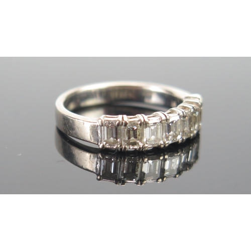 112 - An 18ct White Gold and Baguette Cut Diamond Half Eternity Ring, c. 3.9x3.1mm stones, size M.25, stam... 