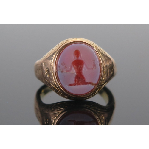 119 - An Antique Precious Yellow Metal Sheathed Hardstone Cameo Ring decorated with a lady holding a caste... 