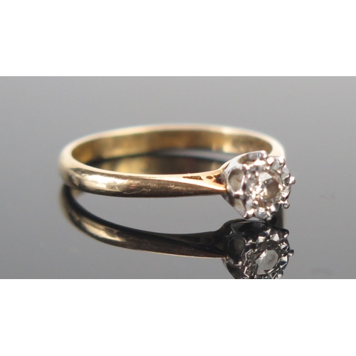 128 - An 18ct Gold and Brilliant Cut Diamond Illusion Set Solitaire Ring, size M.5, hallmarked, 2.38g